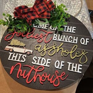 Festive Black Holiday Sign with Red and Green Accents